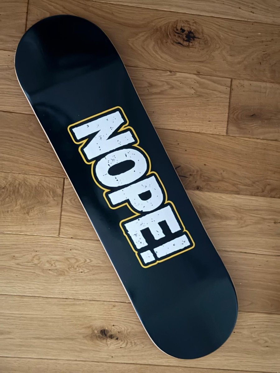 NOPE! Skateboard full view on floor