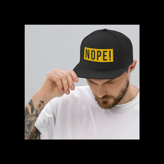 Man wearing High profile cap with yellow embroided NOPE!