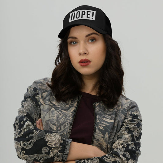 Woman wearing Black cap with white embroided NOPE!