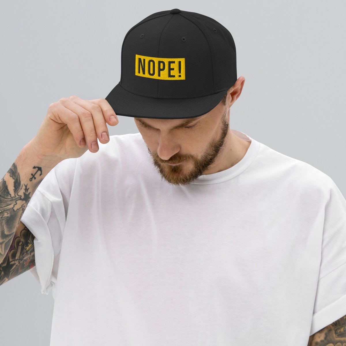 Man wearing NOPE! Culture embroided NOPE! hat