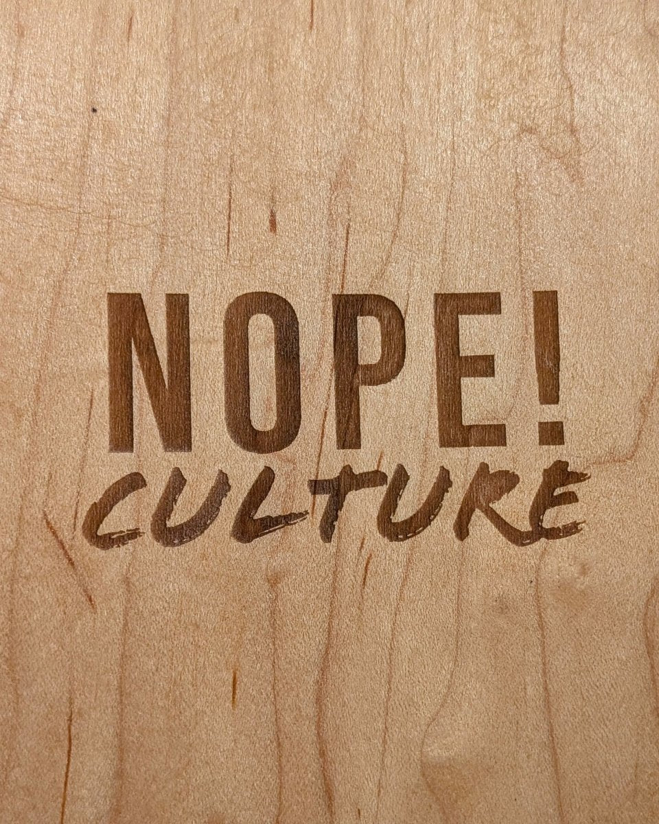 NOPE! Culture logo up close on topside of the skateboard