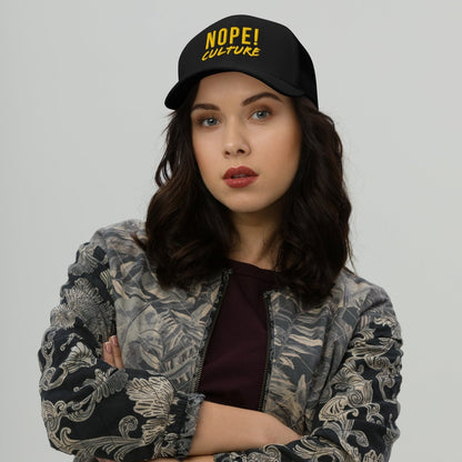 Woman wearing black NOPE! Culture trucker cap with bold yellow writing